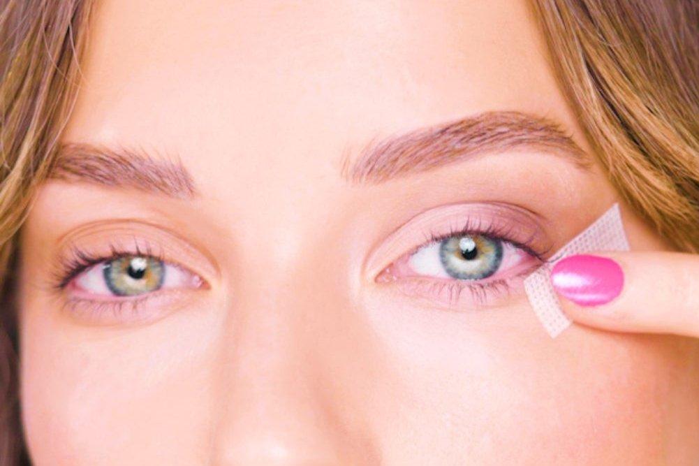 image showing snatched tape being applied to the eye area